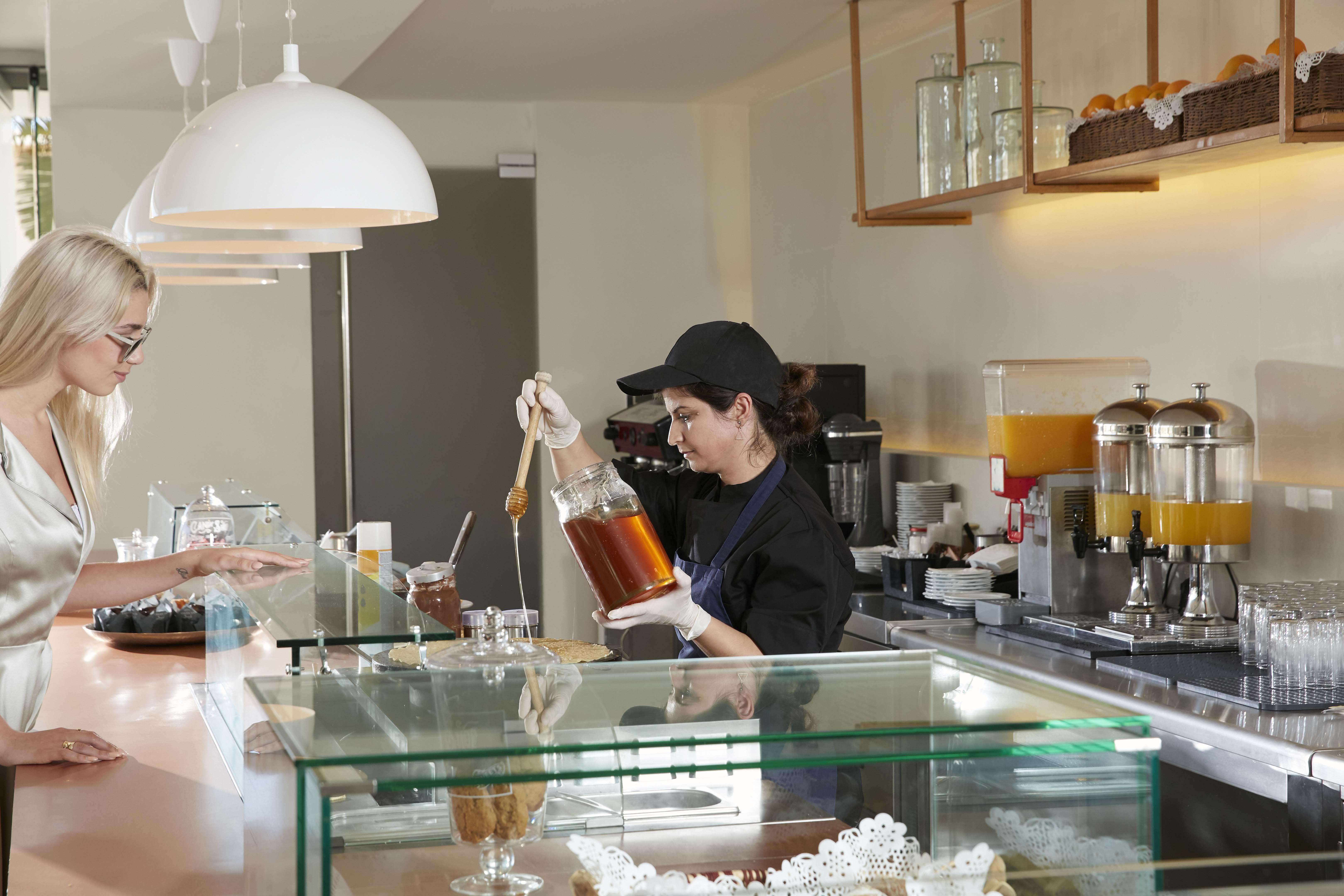 Electra Palace Rhodes Jalisos Zewnętrze zdjęcie A bartender at work